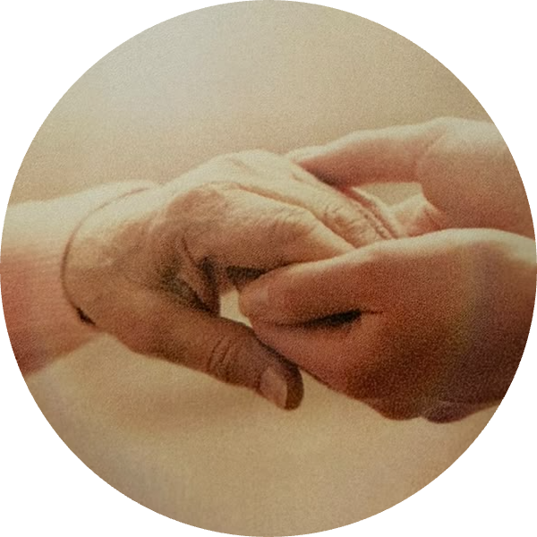 A caregiver holding a client's hand
